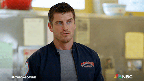 Man In Chicago Fire Department Jacket In Kitchen GIF