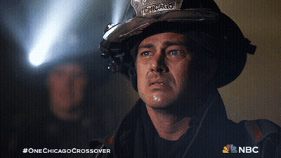Man In Chicago Helmet Looking At Something GIF