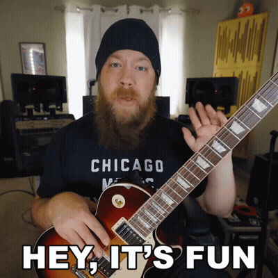 Man In Chicago Shirt Playing Guitar GIF