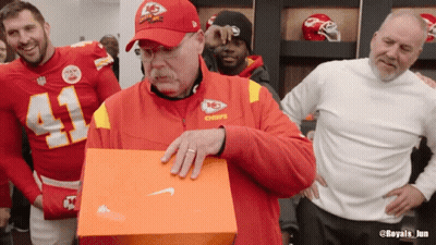 Man In Chiefs Jacket Holding Box GIF
