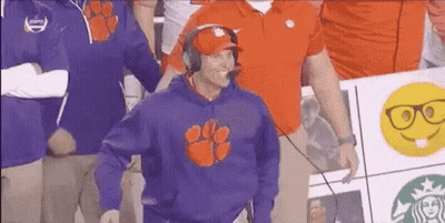 Man In Clemson Sweatshirt And Headphones In Front Of Crowd GIF