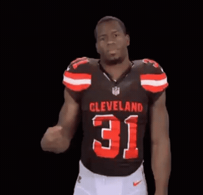 Man In Cleveland 31 Jersey Flexing Arm GIF