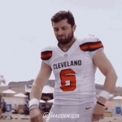 Man In Cleveland Browns Jersey On Beach With Arms Outstretched GIF