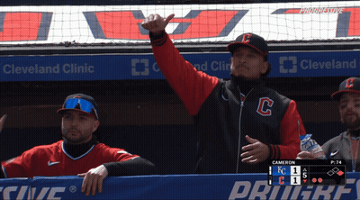 Man In Cleveland Clinic Jacket In Dugout GIF