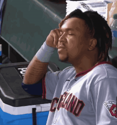 Man In Cleveland Jersey Sitting By Cooler GIF
