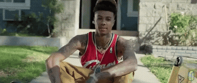 Man In Cleveland Jersey Sitting On Sidewalk GIF