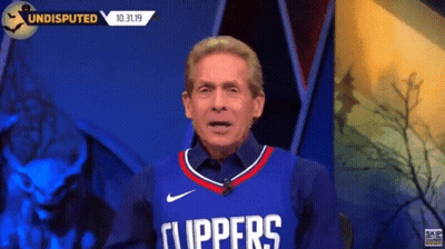 Man In Clippers Jersey Talking On TV GIF