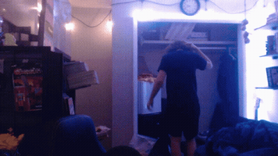Man In Closet With Clock GIF