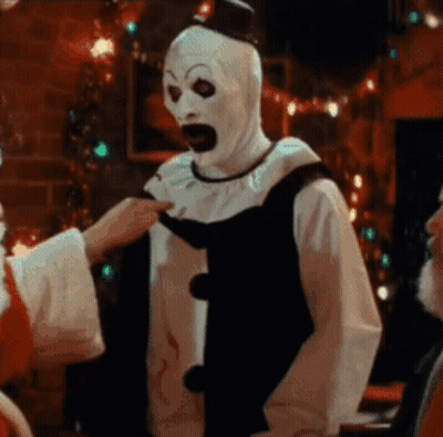 Man In Clown Costume Touched By Santa GIF