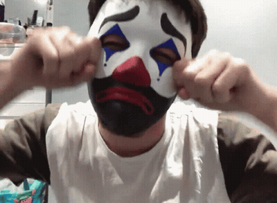 Man In Clown Mask Covering Face GIF