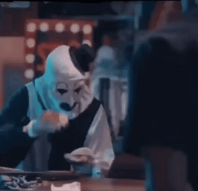 Man In Clown Mask Eating Food GIF