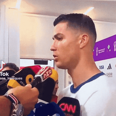 Man In CNN Shirt Interviewed By Reporter GIF