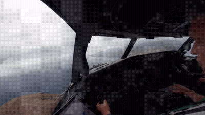 Man in Cockpit Looking Out Window