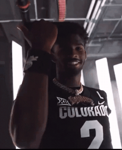 Man In Colorado Jersey Holding Microphone GIF