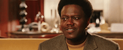 Man In Colorful Jacket Dancing Saying Who You Wit GIF