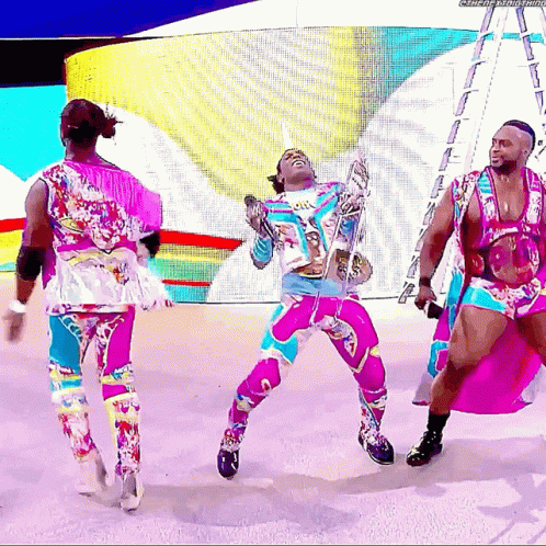 Man In Colorful Outfit Dancing With Microphone GIF