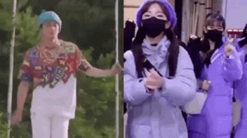 Man In Colorful Shirt And Woman In Purple Coat Standing Together GIF