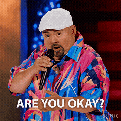 Man In Colorful Shirt Holding Microphone Says Are You Okay GIF