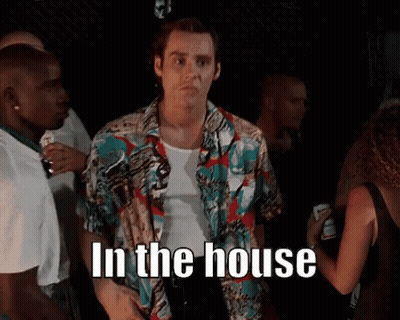 Man In Colorful Shirt In Crowd Saying In The House GIF