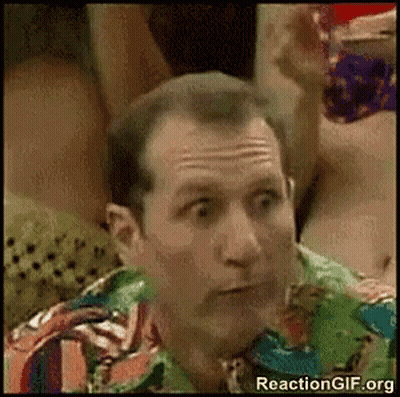 Man In Colorful Shirt Making Funny Face GIF