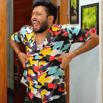 Man In Colorful Shirt Standing Hands On Hips GIF