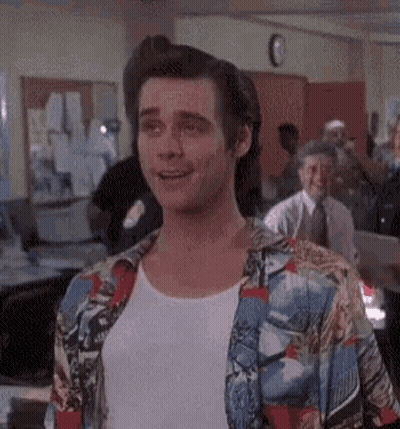 Man In Colorful Shirt Standing With Group GIF