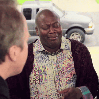Man In Colorful Shirt Talking To Another Man In Front Of Ford Truck GIF
