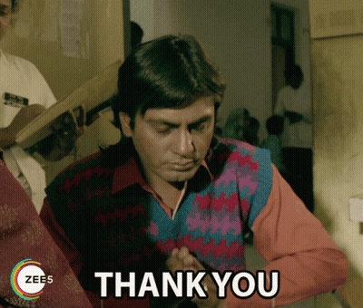 Man In Colorful Sweater Giving Thank You Sign GIF