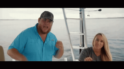 Man In Columbia Blue Shirt On Boat GIF
