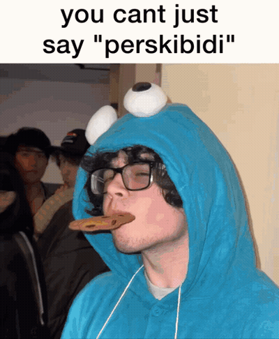 Man In Cookie Monster Costume Eating Cookie GIF