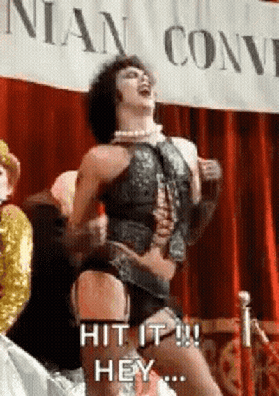Man In Corset Dancing On Stage Hit It Hey GIF