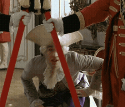 Man In Costume Held Up By Another Man GIF
