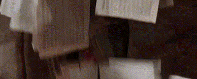 Man In Costume Held Up By Another Man GIF