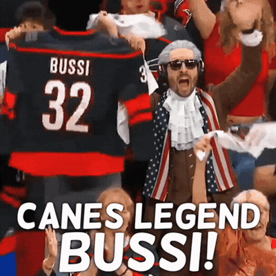 Man In Costume Holding Up Jersey Number 32 GIF