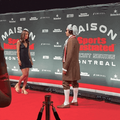 Man In Costume On Red Carpet At Maison Sports Illustrated GIF
