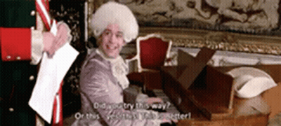 Man In Costume Playing Piano Talking To Another Man GIF