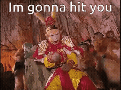 Man In Costume Sitting With Monkeys Saying Im Gonna Hit You GIF