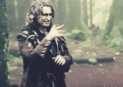 Man In Costume Smiling In Woods GIF