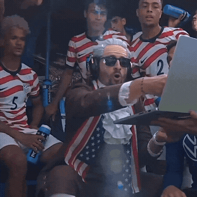 Man In Costume With Number 2 GIF