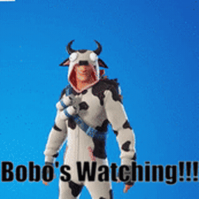 Man In Cow Costume Next To Monkey With Bananas On Head GIF