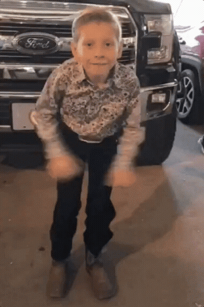 Man In Cowboy Boots And Baseball Cap In Store GIF