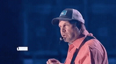 Man In Cowboy Hat And 3D Glasses Looking GIF