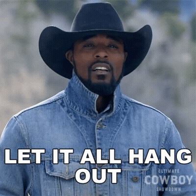 Man in Cowboy Hat and Denim Jacket Saying Let It All Hang Out