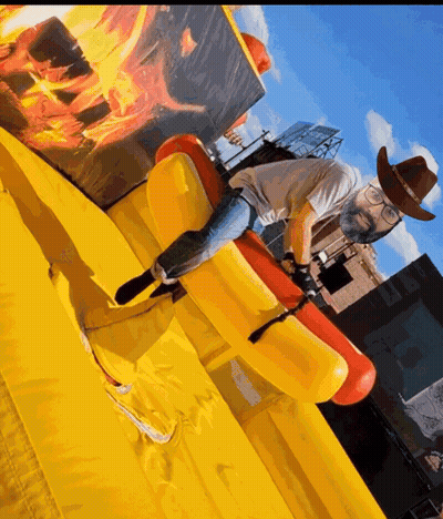 Man In Cowboy Hat And Glasses Riding Inflatable Horse GIF