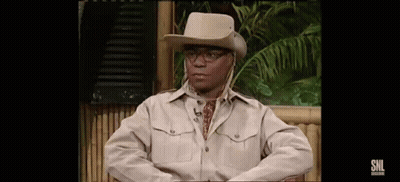 Man In Cowboy Hat And Glasses Sitting On Chair GIF