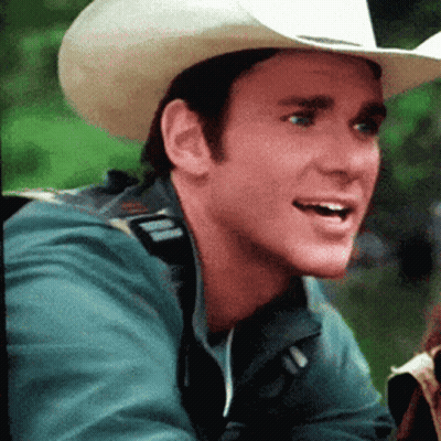 Man In Cowboy Hat And Green Jacket Smiling GIF