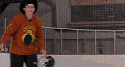 Man In Cowboy Hat And Hockey Jersey In Front Of Sign GIF