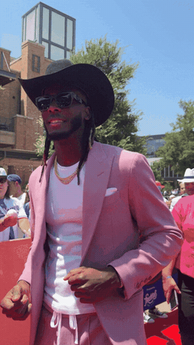 Man In Cowboy Hat And Pink Suit GIF