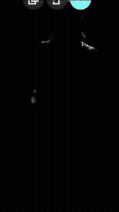 Hombre con sombrero de vaquero y camisa a cuadros de pie en la oscuridad GIF
