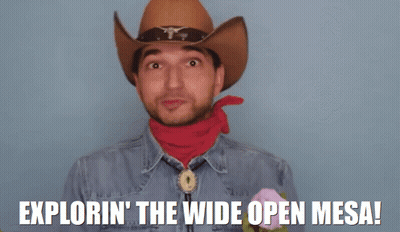 Man In Cowboy Hat And Red Bandana Saying Exploring The Wide Open Mesa GIF